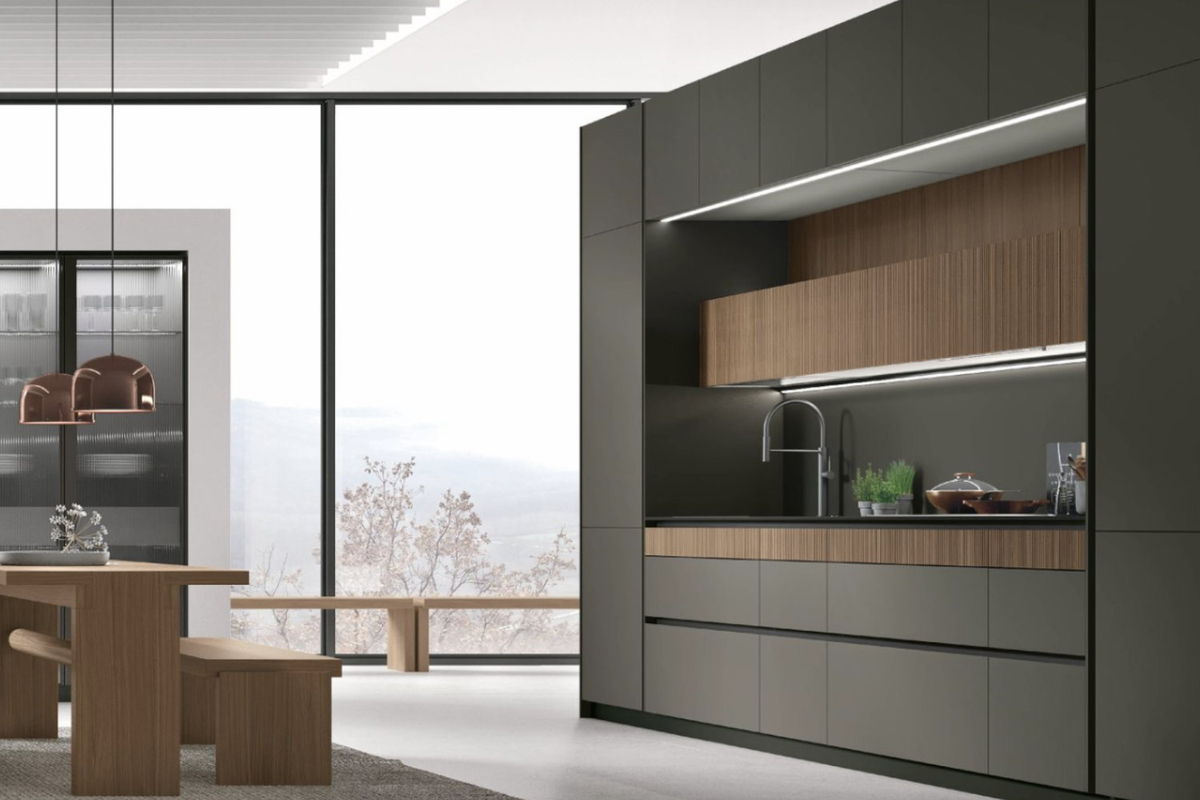 Dark olive Italian kitchen with fluted wood and copper pendants