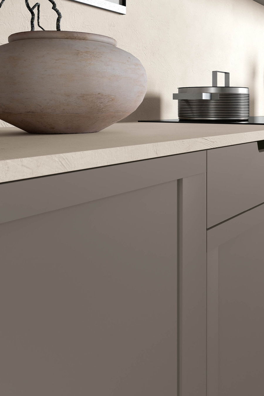 Greige shaker cabinetry with a travertine vessel on a stone counter